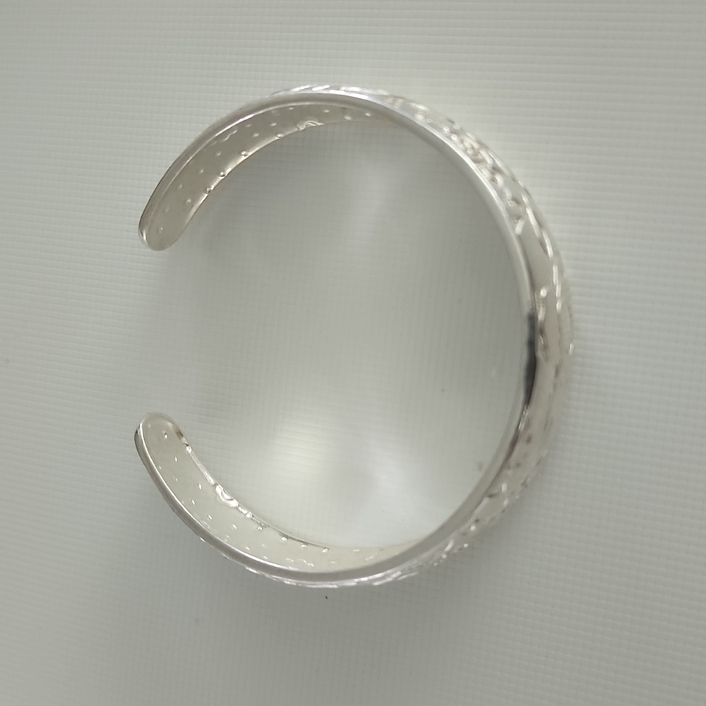 Silver tone flower cuff bracelet